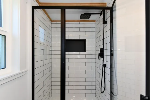 a bathroom with a shower and a sink