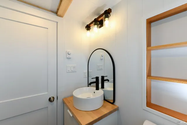 a bathroom with a sink and a mirror