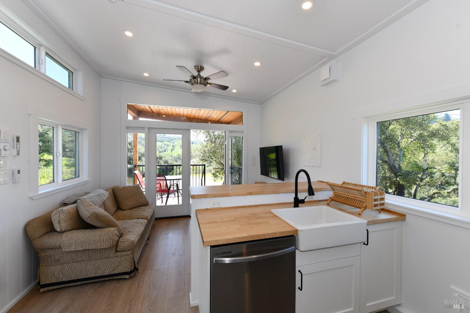 1033 Sundown Trail Santa Rosa, CA 95404 - Photo 29 of 45 a living room with kitchen island furniture and a large window
