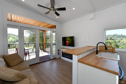 a very nice looking living room with a large window
