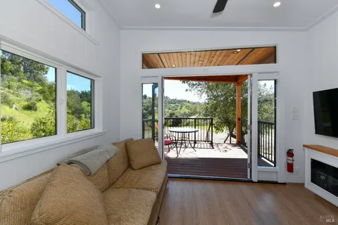 a living room with fireplace furniture and a flat screen tv