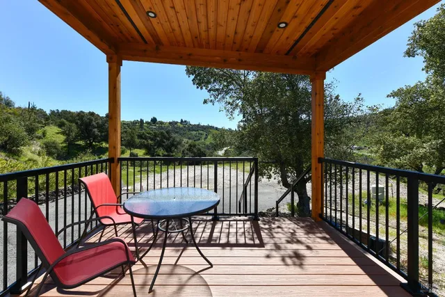 a view of a two chairs in the balcony