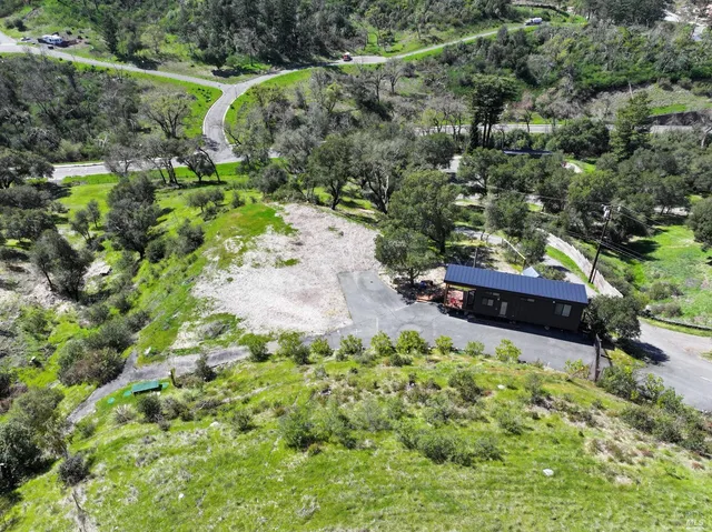 a backyard of a house with a yard and outdoor seating