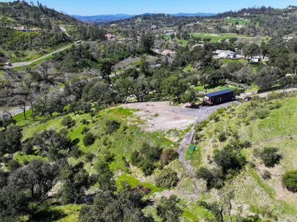 an aerial view of residential house with outdoor space