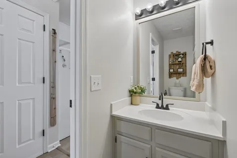 a bathroom with a sink and a mirror