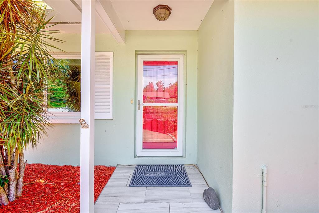 14079 Victoria Road Largo, FL 33774 - Photo 30 of 46 a very nice looking room with a rug
