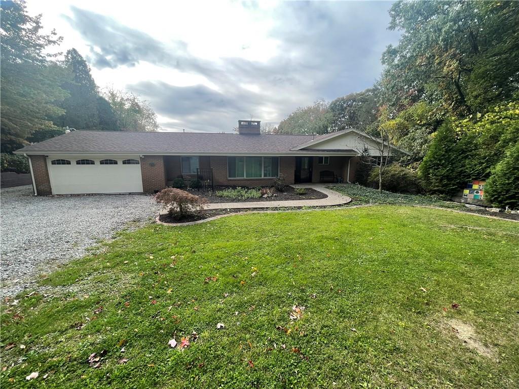 628 Saxonburg Road Butler, PA 16002 - Photo 1 of 46 a front view of house with yard and seating area