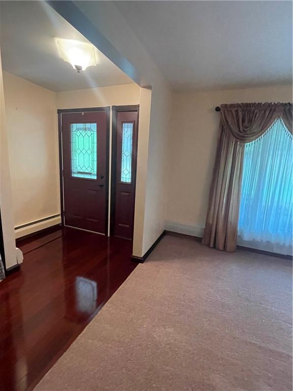 628 Saxonburg Road Butler, PA 16002 - Photo 13 of 46 an empty room with wooden floor and windows