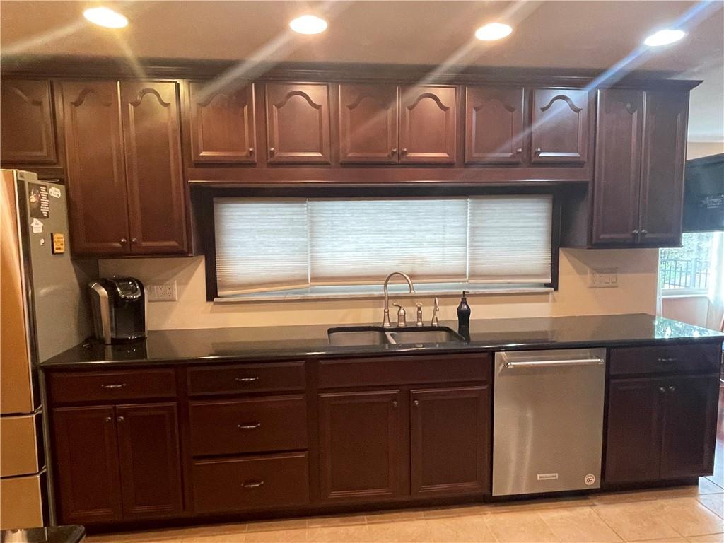 628 Saxonburg Road Butler, PA 16002 - Photo 18 of 46 a kitchen with granite countertop a sink cabinets and stainless steel appliances