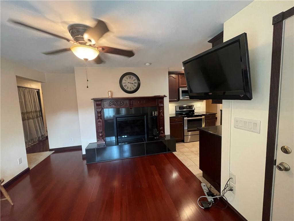 628 Saxonburg Road Butler, PA 16002 - Photo 21 of 46 a living room with furniture a flat screen tv and a fireplace