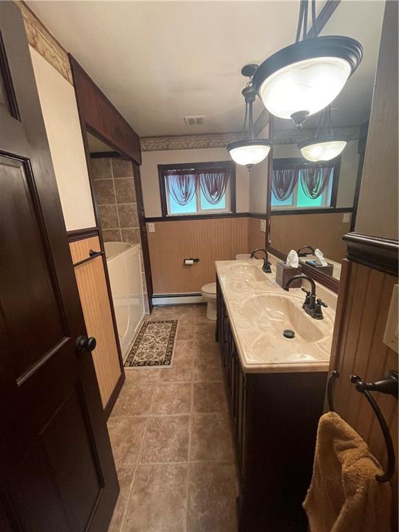 628 Saxonburg Road Butler, PA 16002 - Photo 23 of 46 a bathroom with a sink a mirror a lamp and a window