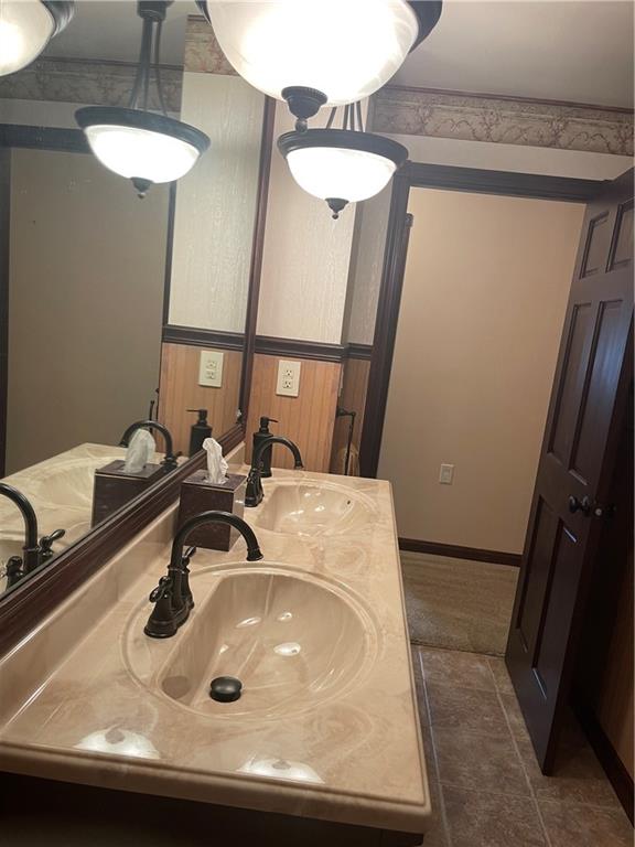 628 Saxonburg Road Butler, PA 16002 - Photo 24 of 46 a bathroom with a sink and a mirror
