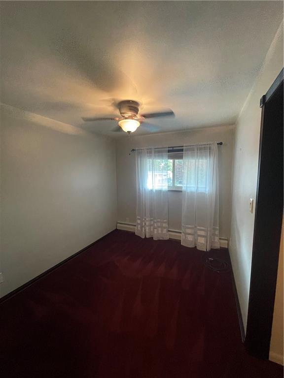 628 Saxonburg Road Butler, PA 16002 - Photo 26 of 46 an empty room with wooden floor and windows in it