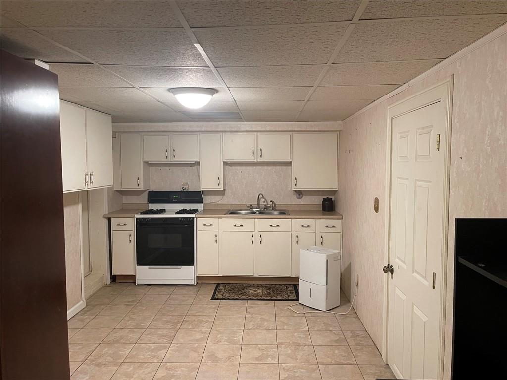 628 Saxonburg Road Butler, PA 16002 - Photo 37 of 46 a kitchen with a refrigerator and a stove