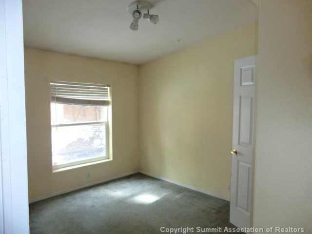 865 Silver Creek Road Idaho Springs, CO 80452 - Photo 7 of 11 an empty room with a window