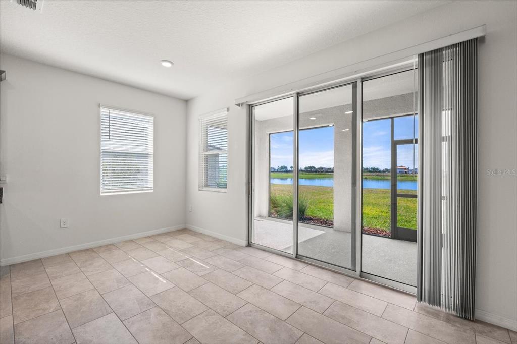 17738 Pastureland Avenue Lakewood Ranch, FL 34211 - Photo 13 of 50 a view of an empty room with glass door