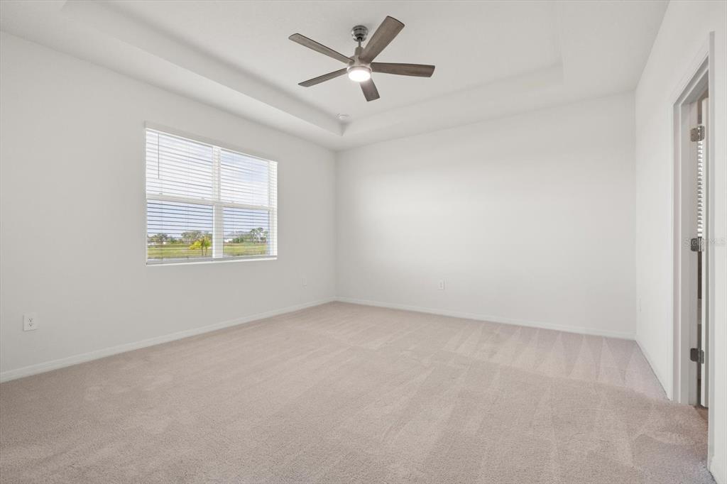 17738 Pastureland Avenue Lakewood Ranch, FL 34211 - Photo 14 of 50 an empty room with a window and a ceiling fan
