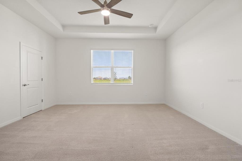 17738 Pastureland Avenue Lakewood Ranch, FL 34211 - Photo 16 of 50 an empty room with a window and a fan