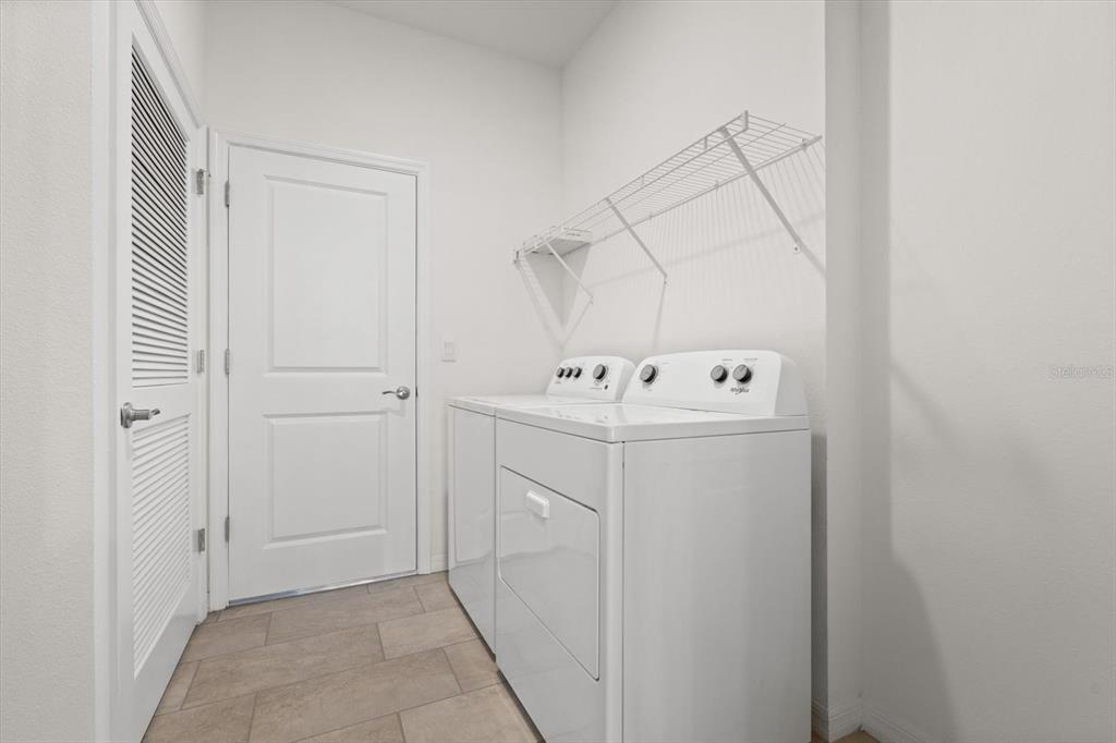 17738 Pastureland Avenue Lakewood Ranch, FL 34211 - Photo 25 of 50 a utility room with dryer and washer