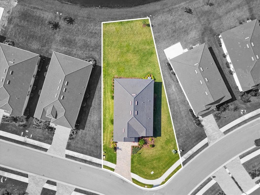 17738 Pastureland Avenue Lakewood Ranch, FL 34211 - Photo 31 of 50 an aerial view of a house with a swimming pool