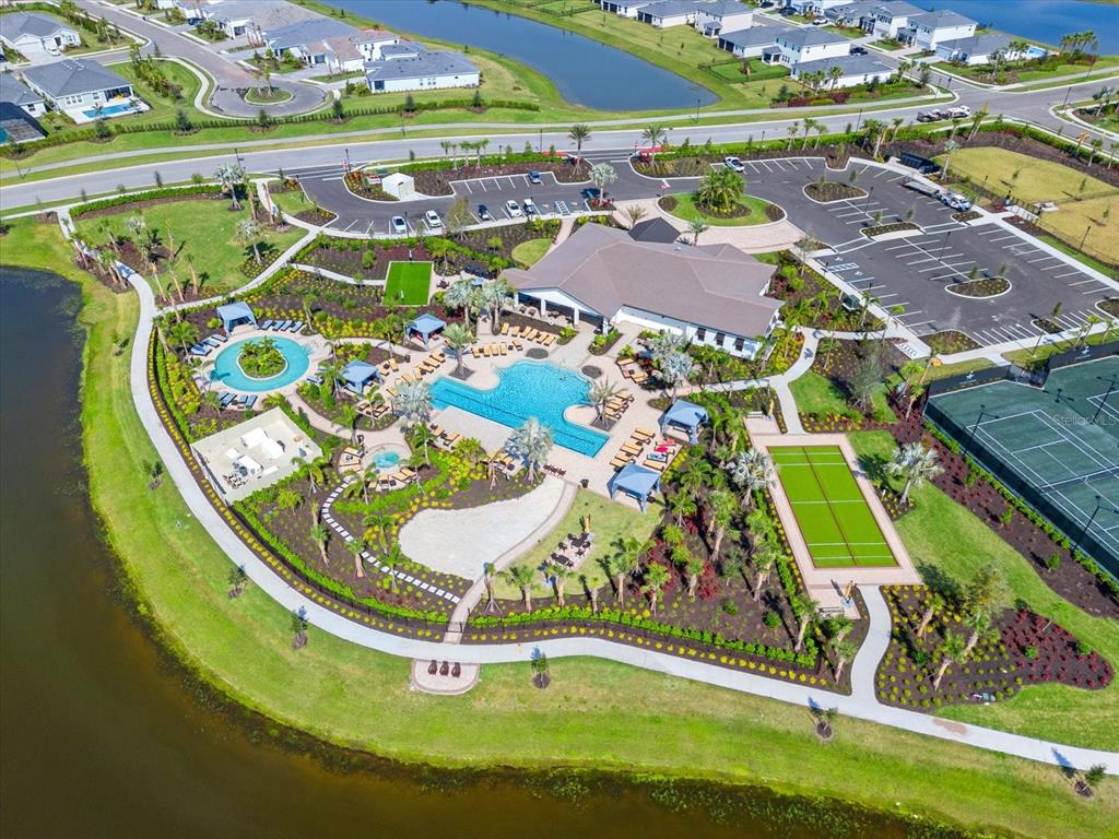17738 Pastureland Avenue Lakewood Ranch, FL 34211 - Photo 34 of 50 an aerial view of a house with a garden and swimming pool