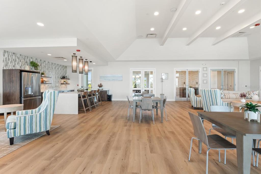 17738 Pastureland Avenue Lakewood Ranch, FL 34211 - Photo 43 of 50 a view of a dining room with furniture and wooden floor