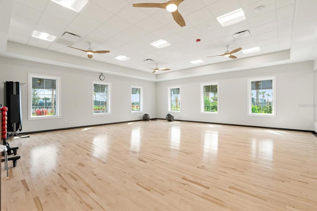17738 Pastureland Avenue Lakewood Ranch, FL 34211 - Photo 45 of 50 a view of an empty room with wooden floor and a window