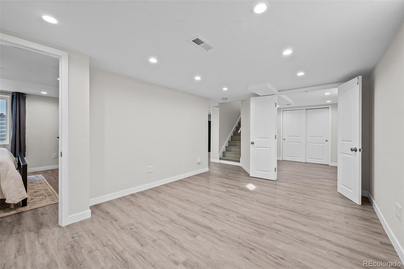 2344 South Lafayette Street Denver, CO 80210 - Photo 17 of 32 a view of empty room with wooden floor