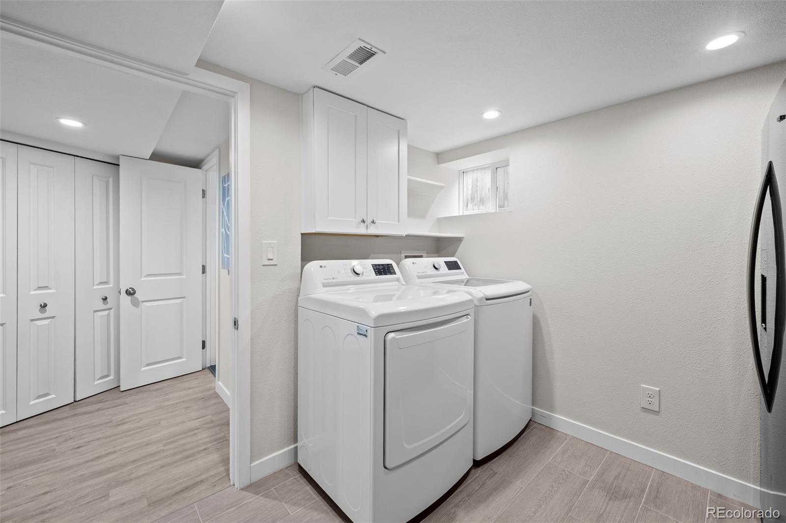2344 South Lafayette Street Denver, CO 80210 - Photo 26 of 32 a utility room with dryer and washer