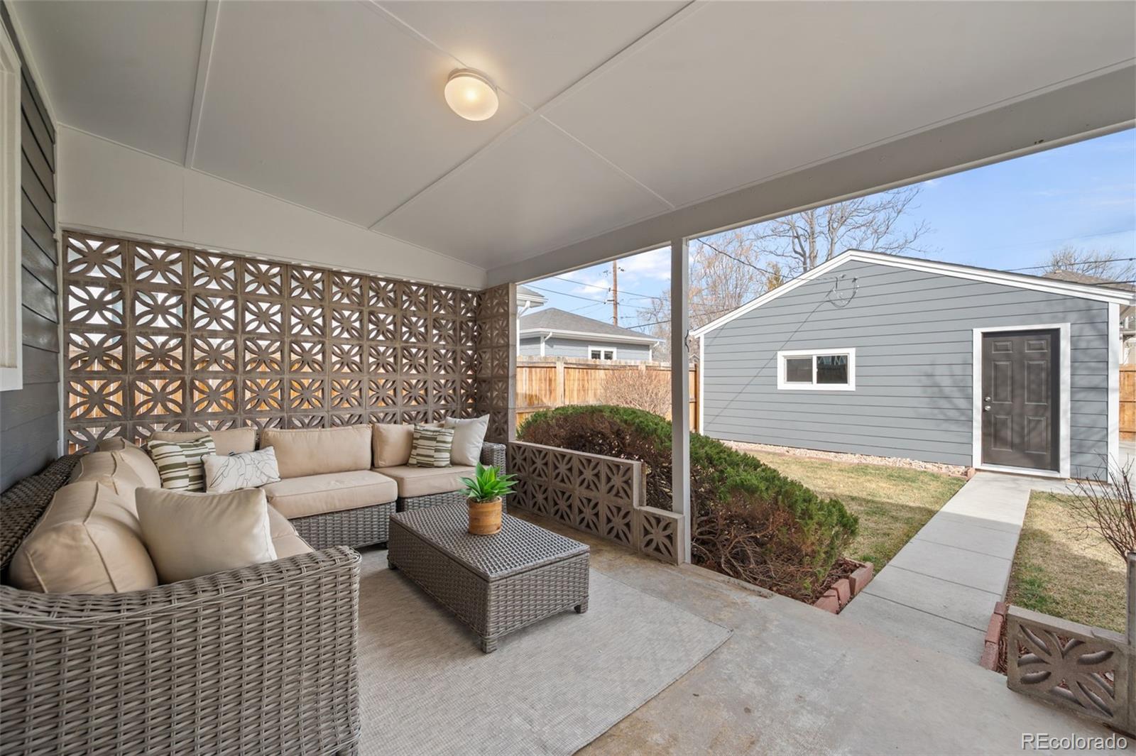 2344 South Lafayette Street Denver, CO 80210 - Photo 28 of 32 a living room with furniture and a window