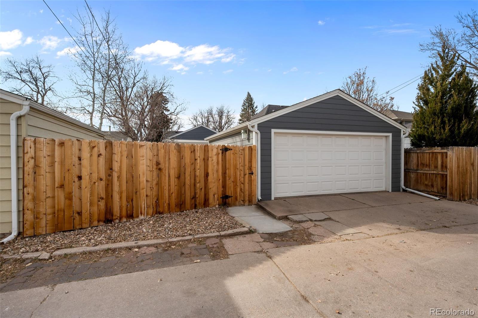 2344 South Lafayette Street Denver, CO 80210 - Photo 30 of 32 a front view of a house with a garage