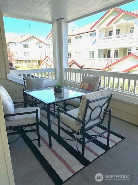 23943 Northeast 115th Lane, Unit 204 Redmond, WA 98053 - Photo 19 of 24 a view of a dining room with furniture window and outside view