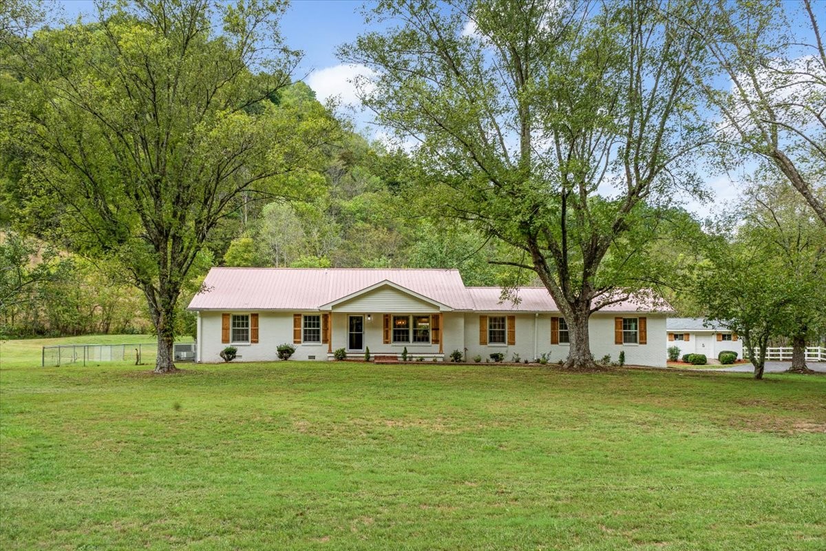 315 Little Creek Road Pleasant Shade, TN 37145 - Photo 3 of 32 a front view of a house with garden