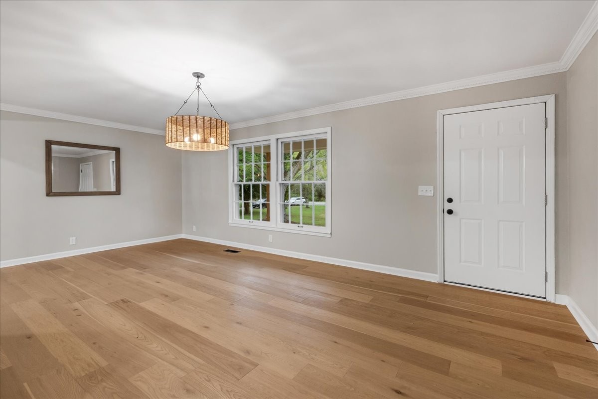 315 Little Creek Road Pleasant Shade, TN 37145 - Photo 6 of 32 a view of an empty room with window and wooden floor
