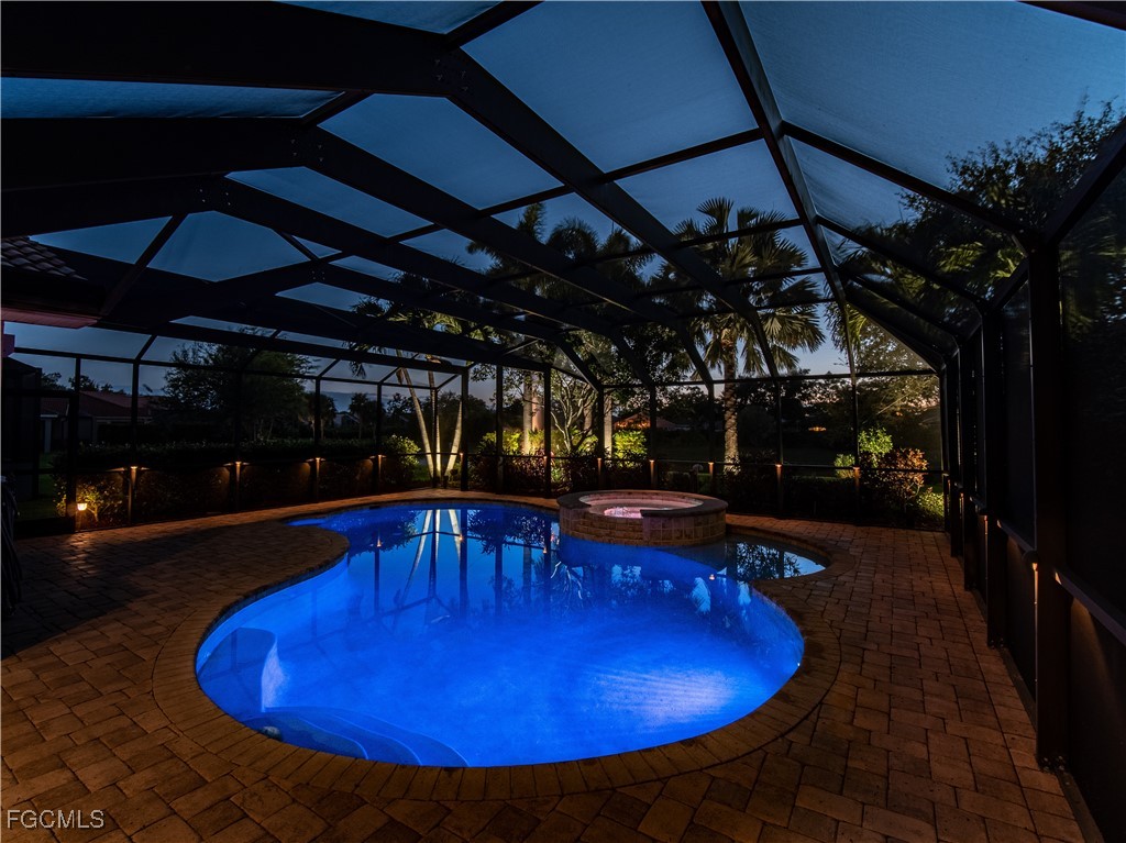 a view of a swimming pool with a patio