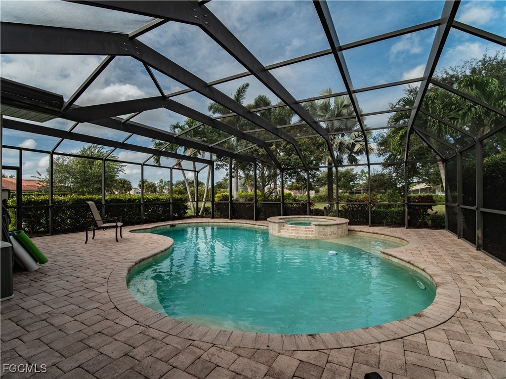 20311 Rookery Drive Estero, FL 33928 - Photo 2 of 29 a view of a swimming pool with a patio