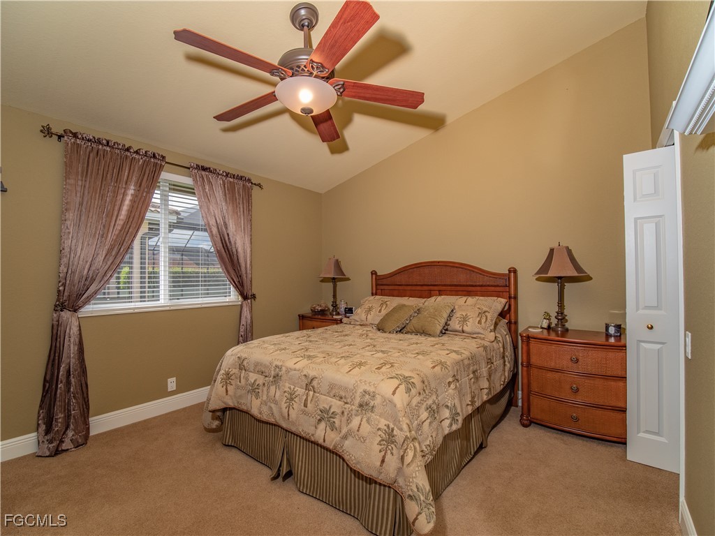 20311 Rookery Drive Estero, FL 33928 - Photo 24 of 29 a bedroom with a bed and a window