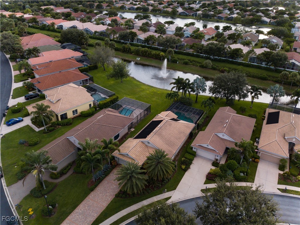 20311 Rookery Drive Estero, FL 33928 - Photo 27 of 29 an aerial view of a city with lots of residential buildings lake and ocean view
