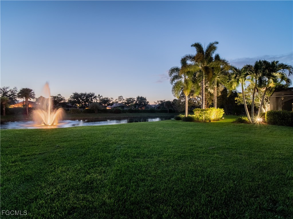 20311 Rookery Drive Estero, FL 33928 - Photo 9 of 29 a view of a golf course of a house with a garden