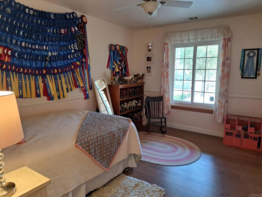 40752 Via De La Roca Fallbrook, CA 92028 - Photo 11 of 37 a living room with furniture and a wooden floor