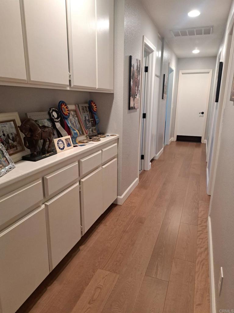 40752 Via De La Roca Fallbrook, CA 92028 - Photo 12 of 37 a kitchen with stainless steel appliances a refrigerator a sink and cabinets