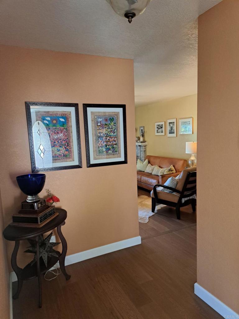 40752 Via De La Roca Fallbrook, CA 92028 - Photo 13 of 37 a living room with furniture and a chair