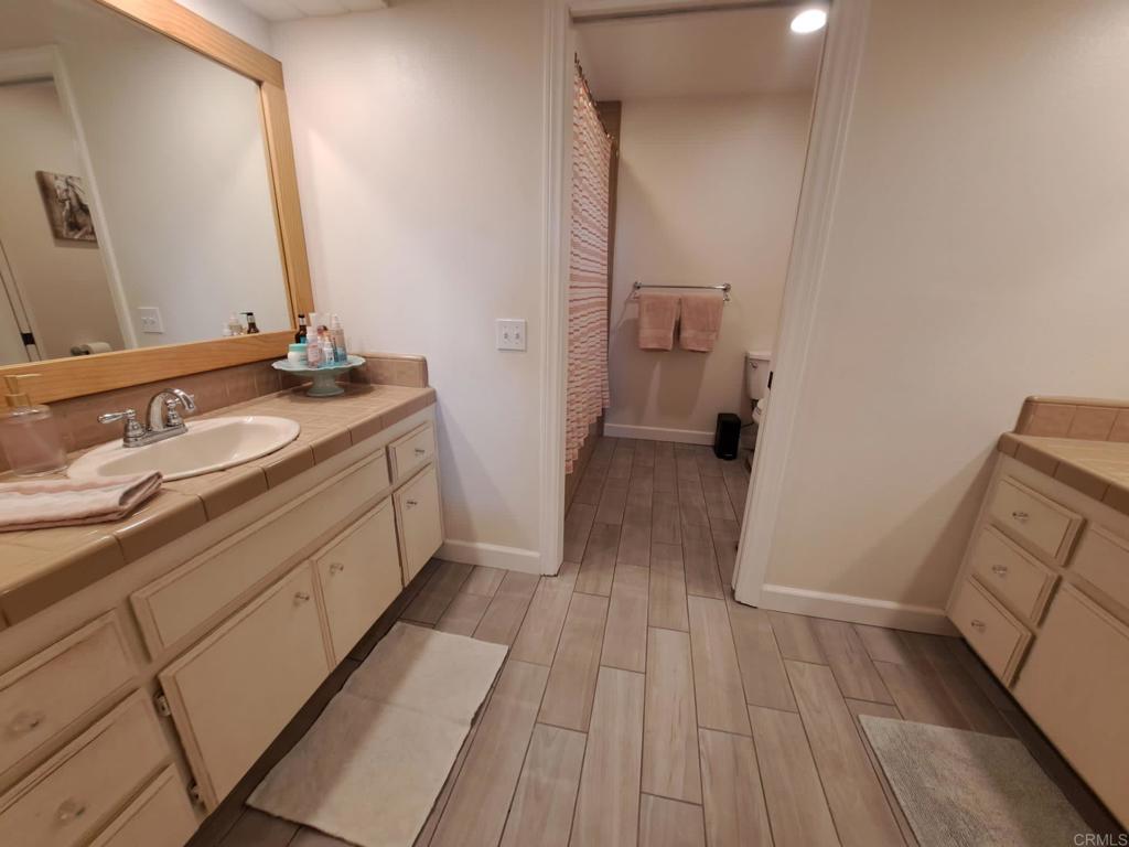 40752 Via De La Roca Fallbrook, CA 92028 - Photo 16 of 37 a bathroom with a sink and a mirror