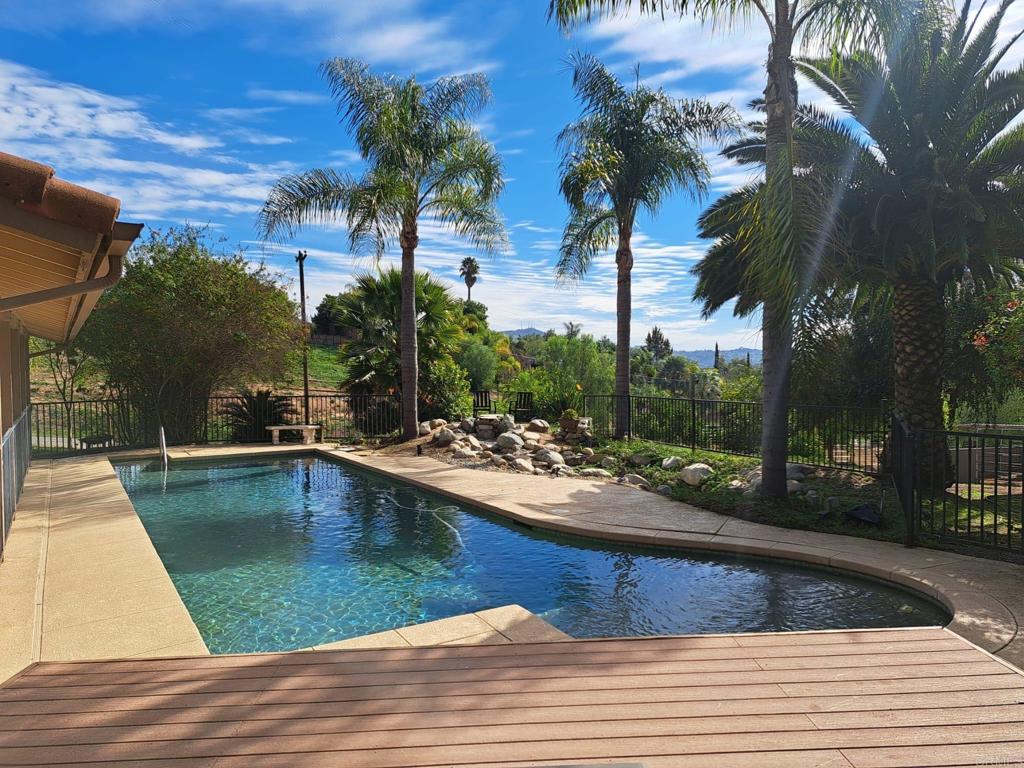 40752 Via De La Roca Fallbrook, CA 92028 - Photo 20 of 37 a view of a swimming pool with a table and chairs