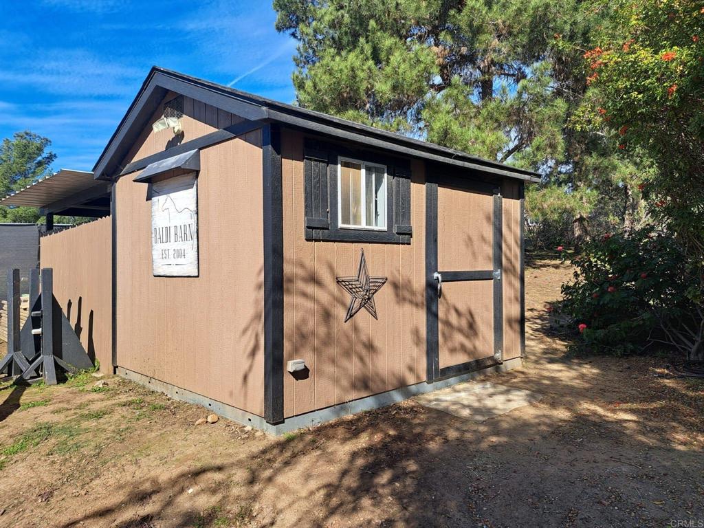 40752 Via De La Roca Fallbrook, CA 92028 - Photo 37 of 37 a backyard of a house with lots of green space