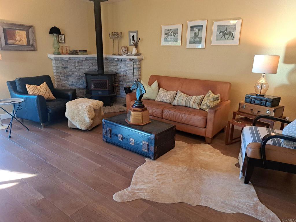 40752 Via De La Roca Fallbrook, CA 92028 - Photo 8 of 37 a living room with furniture and a fireplace