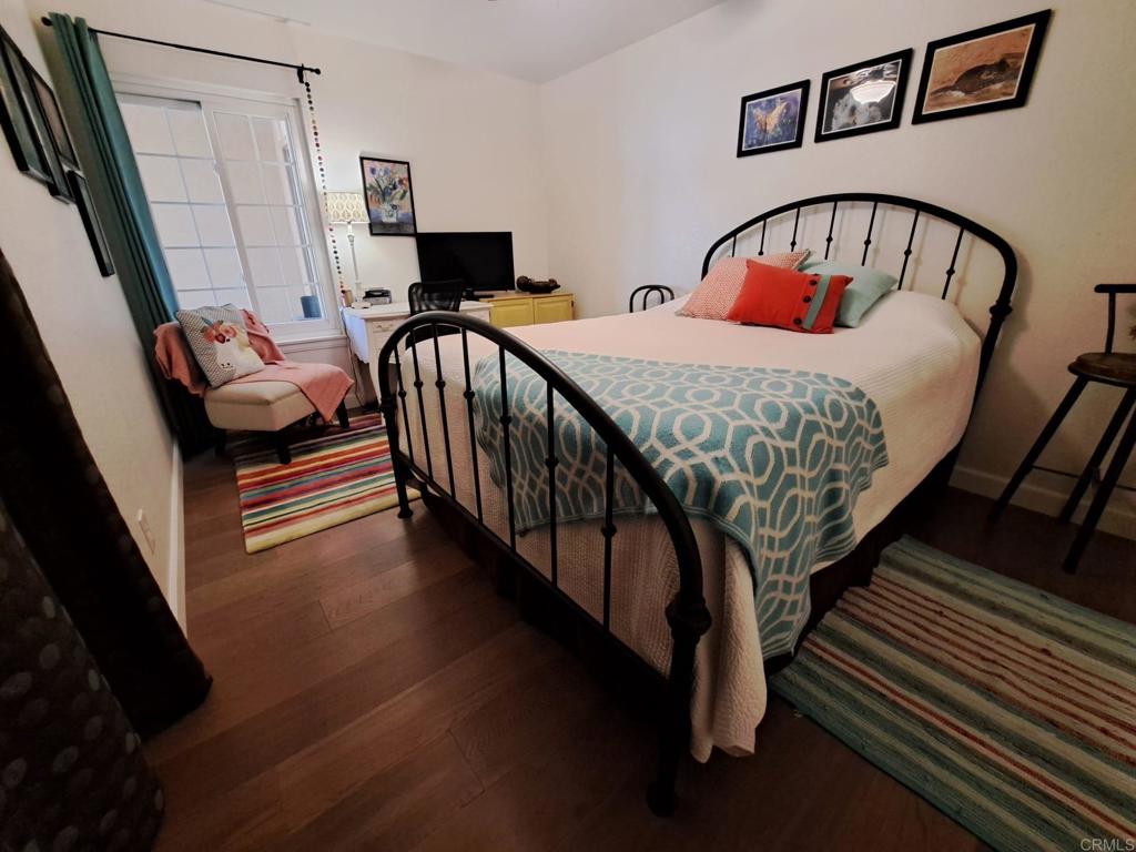 40752 Via De La Roca Fallbrook, CA 92028 - Photo 10 of 37 a bedroom with two beds and a baby crib