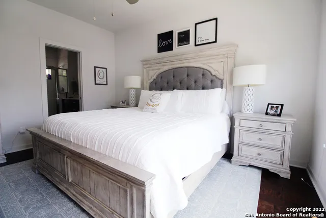 a large white bed in a white room