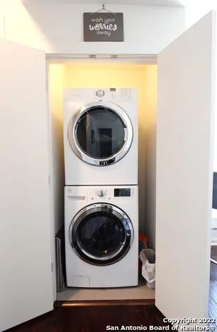 a view of a livingroom with furniture and a staircase