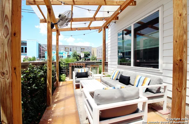 a view of balcony with couch and outdoor seating